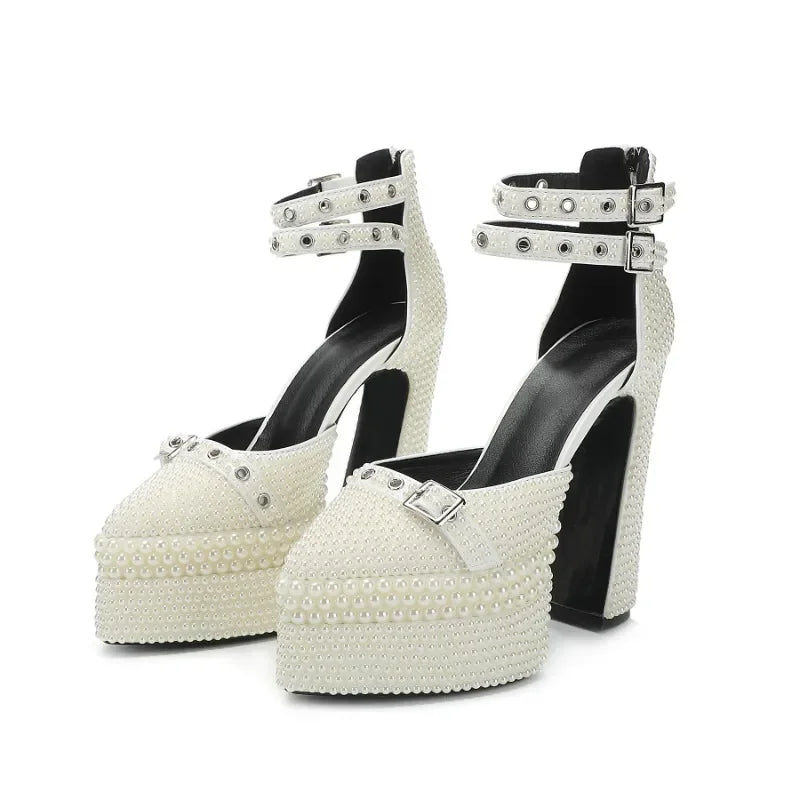 White pearl platform high heels with black soles on a white background