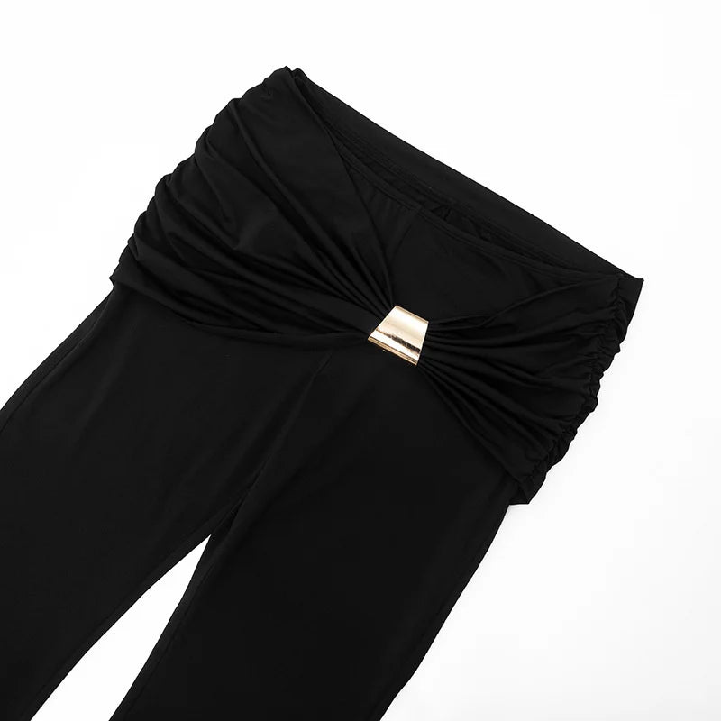 Black pants with a gold belt buckle on a white background