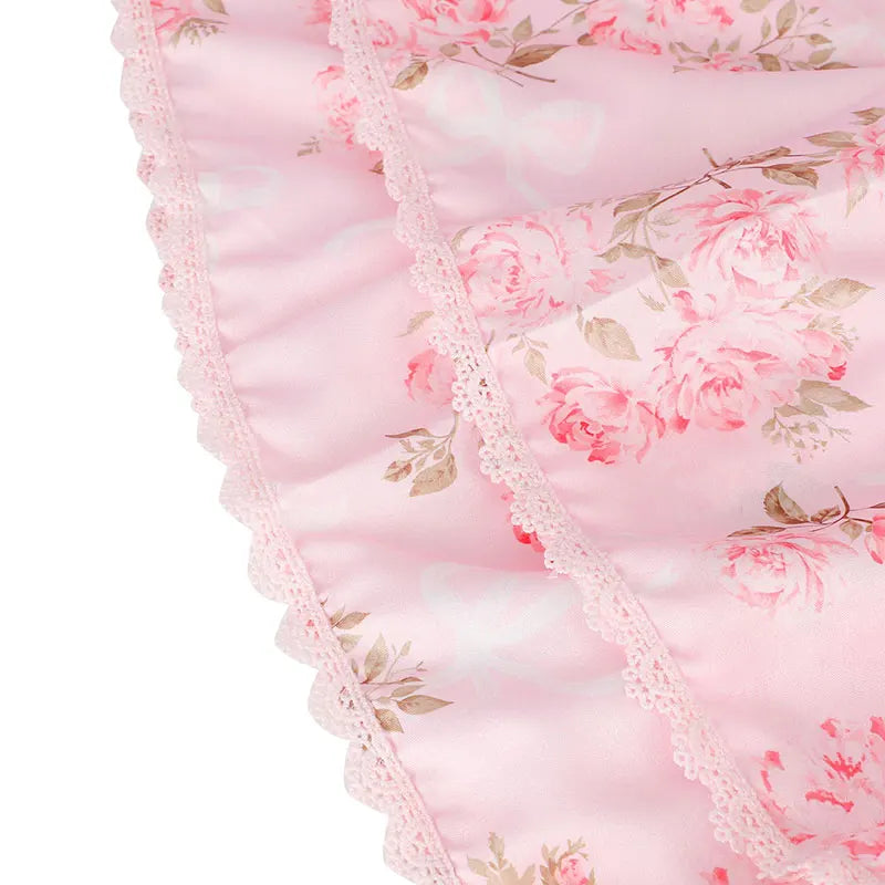 Floral-patterned fabric with pink roses and lace trim 