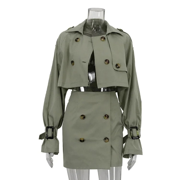 Green trench coat on a mannequin against a white background