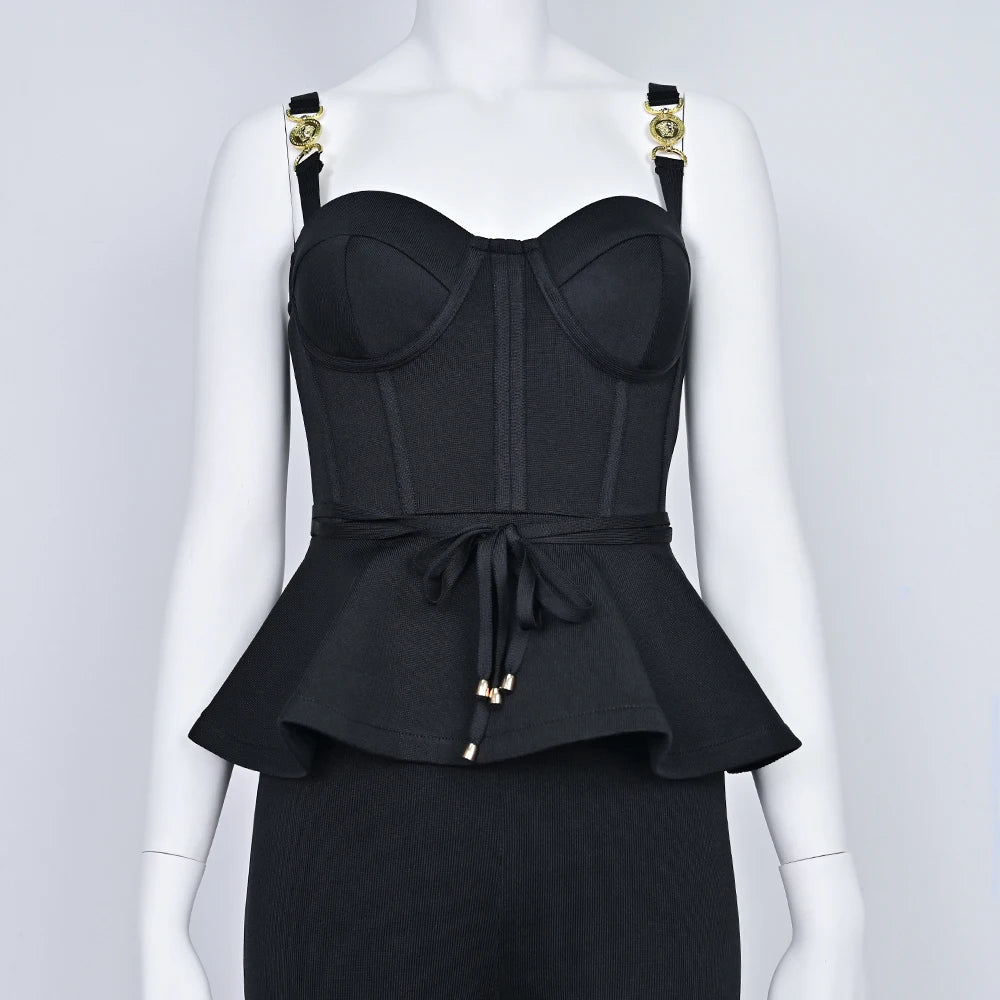 Black peplum top with gold accents on a mannequin against a white background