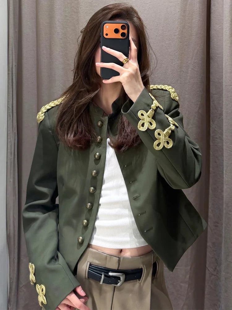 Detail of epaulet and sleeve embroidery on olive green Jacket