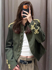 Detail of epaulet and sleeve embroidery on olive green Jacket