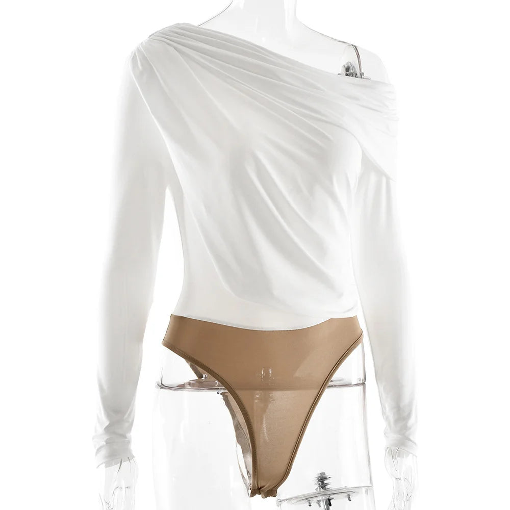 White long-sleeve top with a sheer overlay and beige underwear on a white background