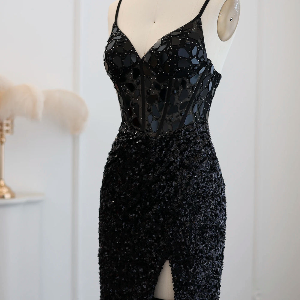 Black sequin jumpsuit on a mannequin against a white background
