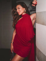 Woman in a red dress posing indoors