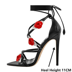 Side profile of a black lace-up stiletto heeled sandal with rose embellishments and 'Heel Height 11CM' indicator.