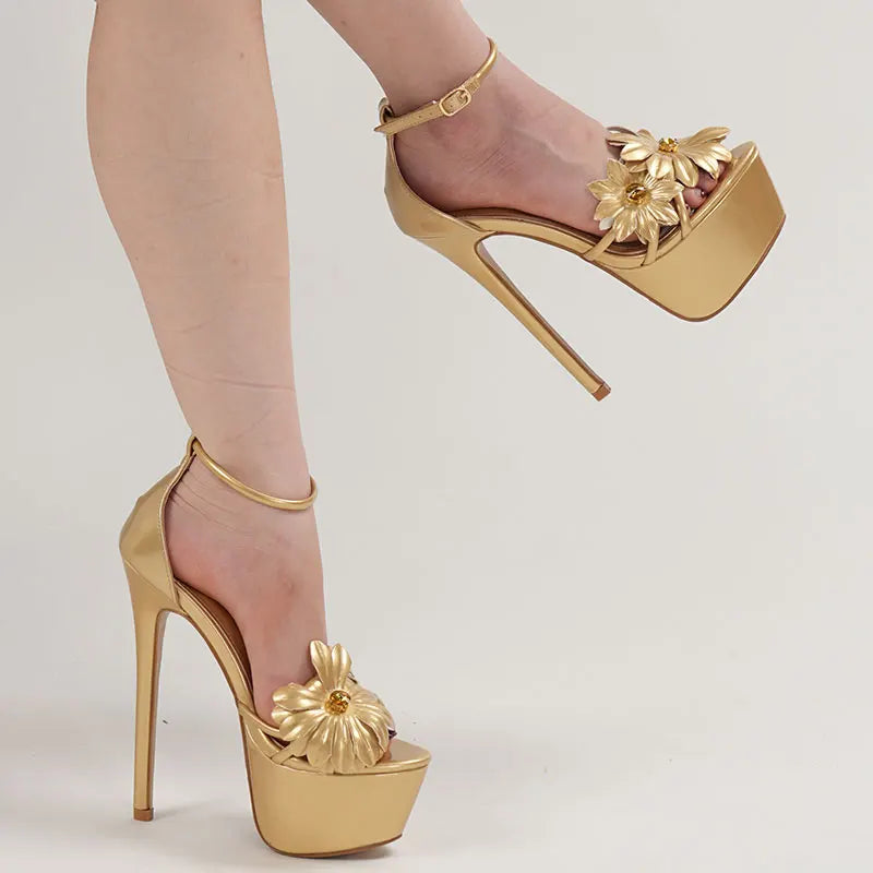 Gold high-heeled shoes with floral designs 