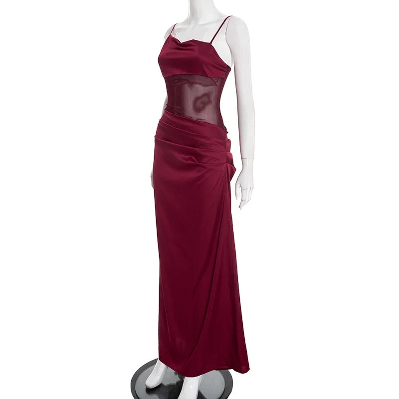 Maroon evening gown on a mannequin against a white background