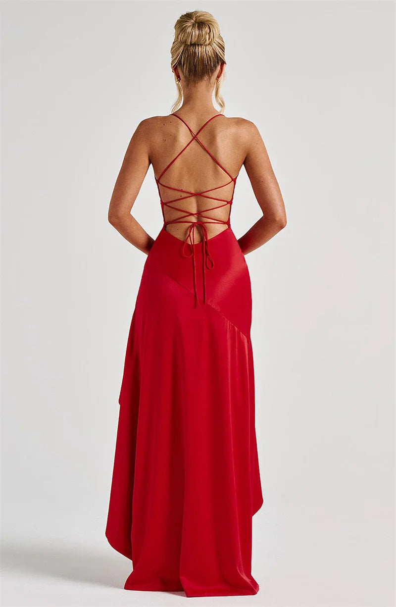 Red evening gown with intricate back design on a white background