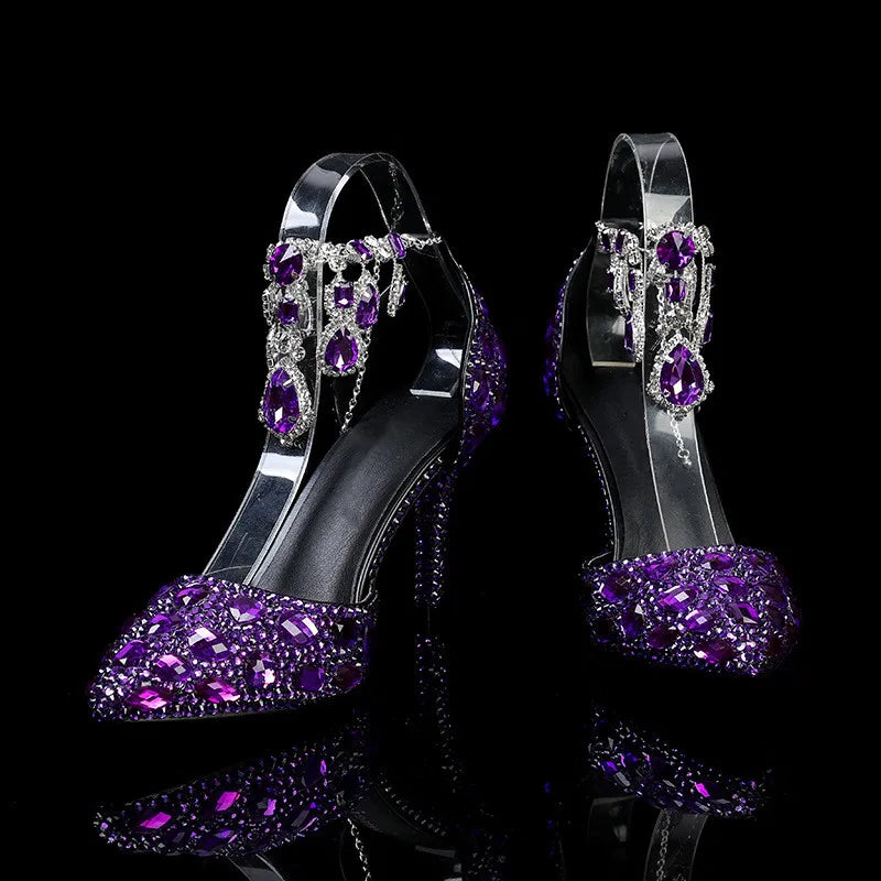 Purple high-heeled shoes with gemstones on a black background