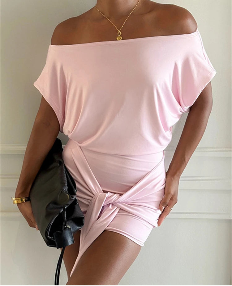 Off-the-shoulder draped mini dress with asymmetric knot detail