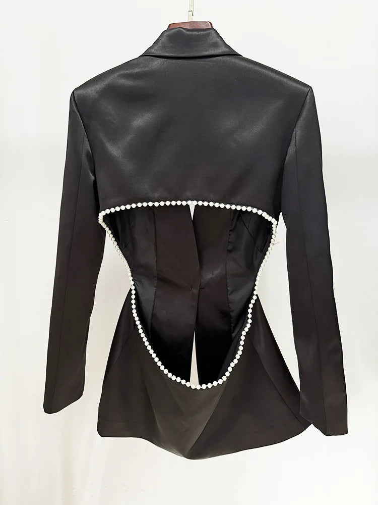 Black leather jacket with pearl embellishments on a white background