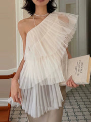 Close-up of the pleated mesh on a one shoulder top