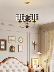 Lifestyle image showcasing the polka dot chandelier as a unique focal point in a minimalist Bed room. Golden Atelier 2