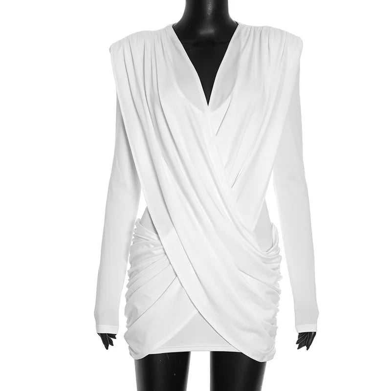 White draped dress on a mannequin against a white background