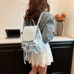 A woman wearing the backpack, demonstrating its comfortable fit and practical use.