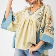 Embroidered V-neck flare sleeve top in pale yellow and blue.