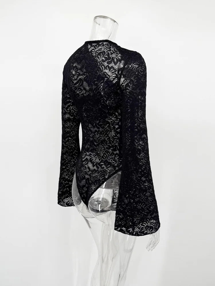 Black floral lace dress on a mannequin against a white background