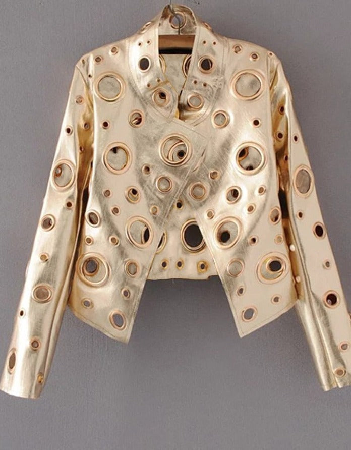 A faux leather short jacket with golden rivet detailing, displayed on a hanger against a plain background.