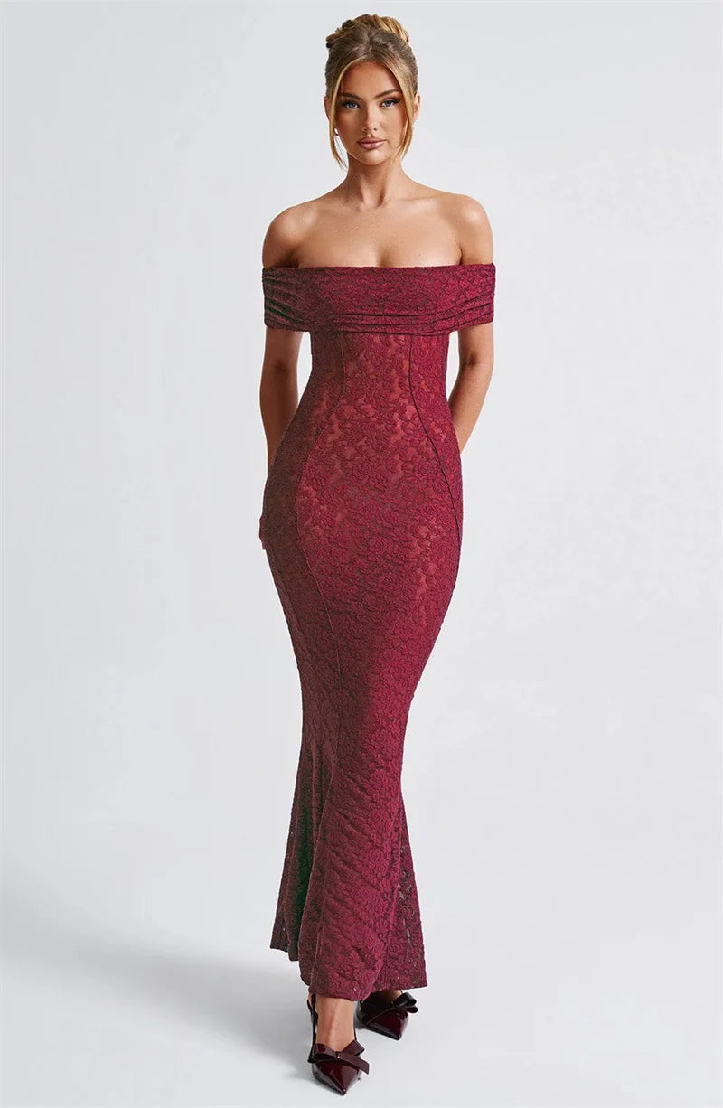 Woman wearing a burgundy off-shoulder lace dress on a white background