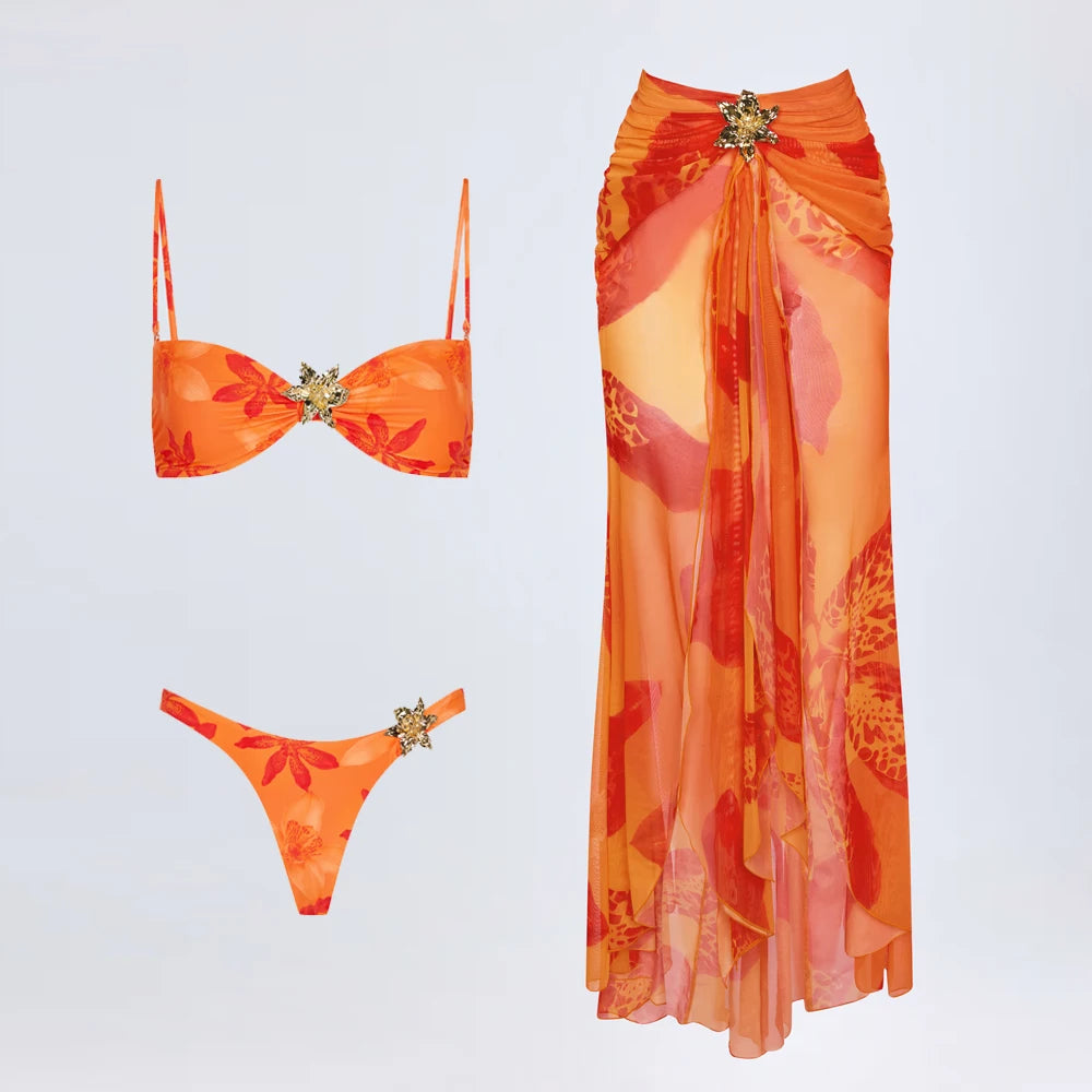 Printed mesh skirt, bikini top, and bikini bottom displayed separately