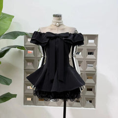 Detail of the frill hem on the black mini dress