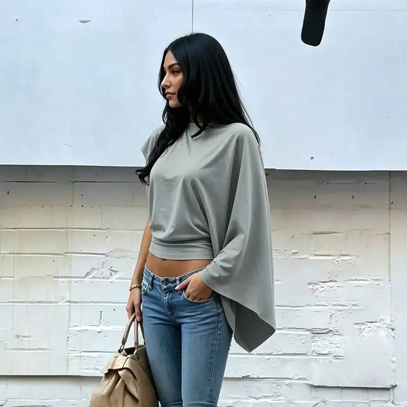 Asymmetrical drop-shoulder knit top in grey