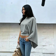Asymmetrical drop-shoulder knit top in grey
