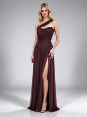 Side view of a brown one-shoulder draped formal gown with a high leg slit.