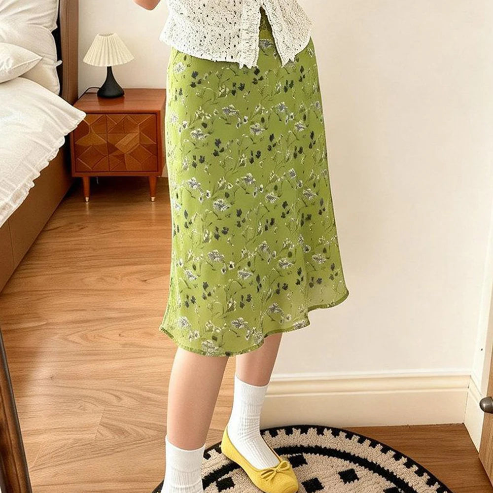 Model wearing floral A-line midi skirt with yellow flats