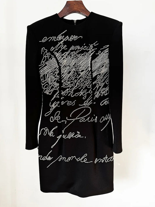 Black beaded script long sleeve mini dress on hanger