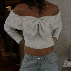 Women's ribbed top with an off-the-shoulder neckline and bow.