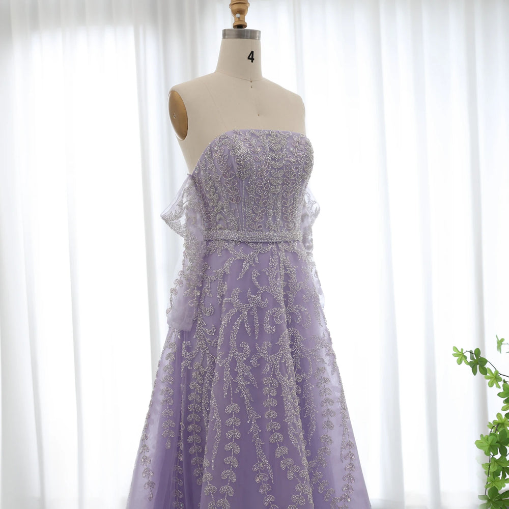 Lavender strapless dress with lace details on a mannequin against a white curtain background.