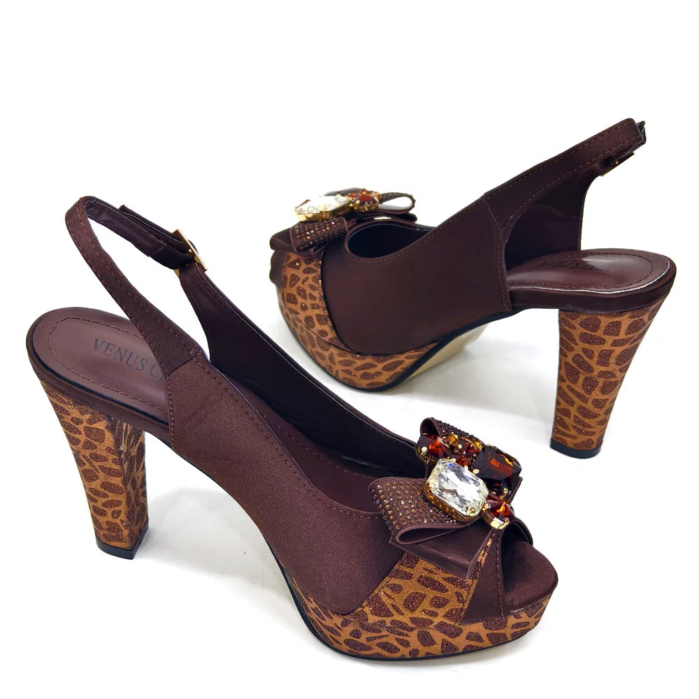 Brown high-heeled shoes with leopard print and decorative bow on a white background