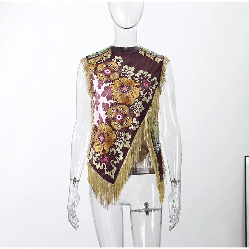 Mannequin wearing a floral patterned top with fringes on a white background