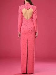 Back view of pink bejeweled maxi dress with heart-shaped open back