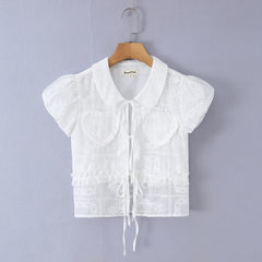 White embroidered puff sleeve crop top with tie front