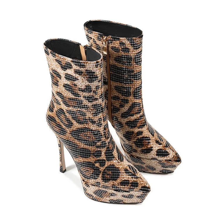 Leopard print high-heeled boots on a white background