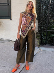 Boho patchwork sleeveless vest with fringe and floral print worn by a model