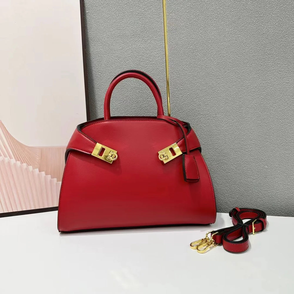 Red leather satchel bag with gold hardware