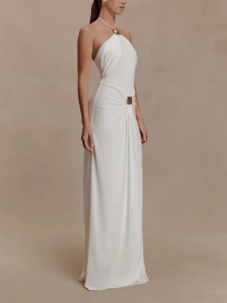 Woman wearing a white strapless gown on a beige background