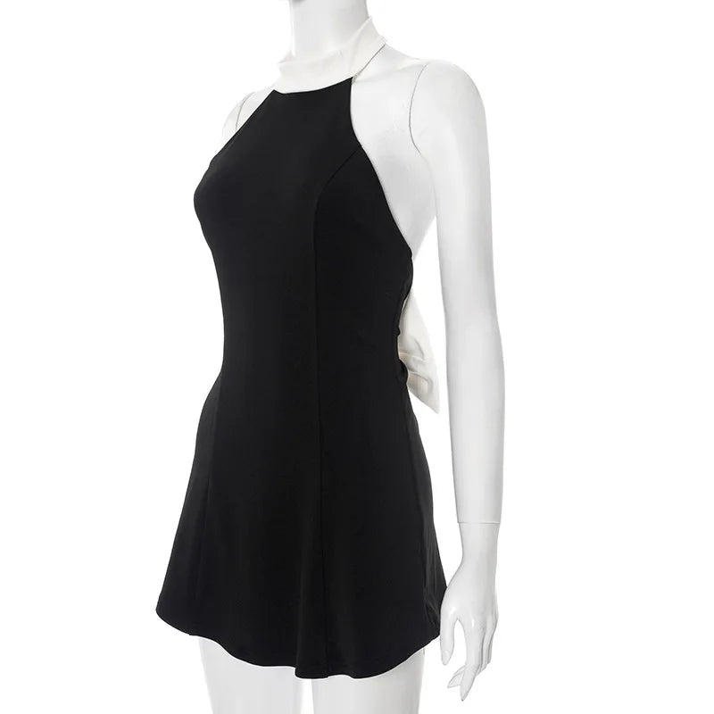 Black dress on a white mannequin against a white background