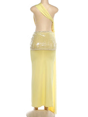 Yellow dress with sequined top on a mannequin against a white background