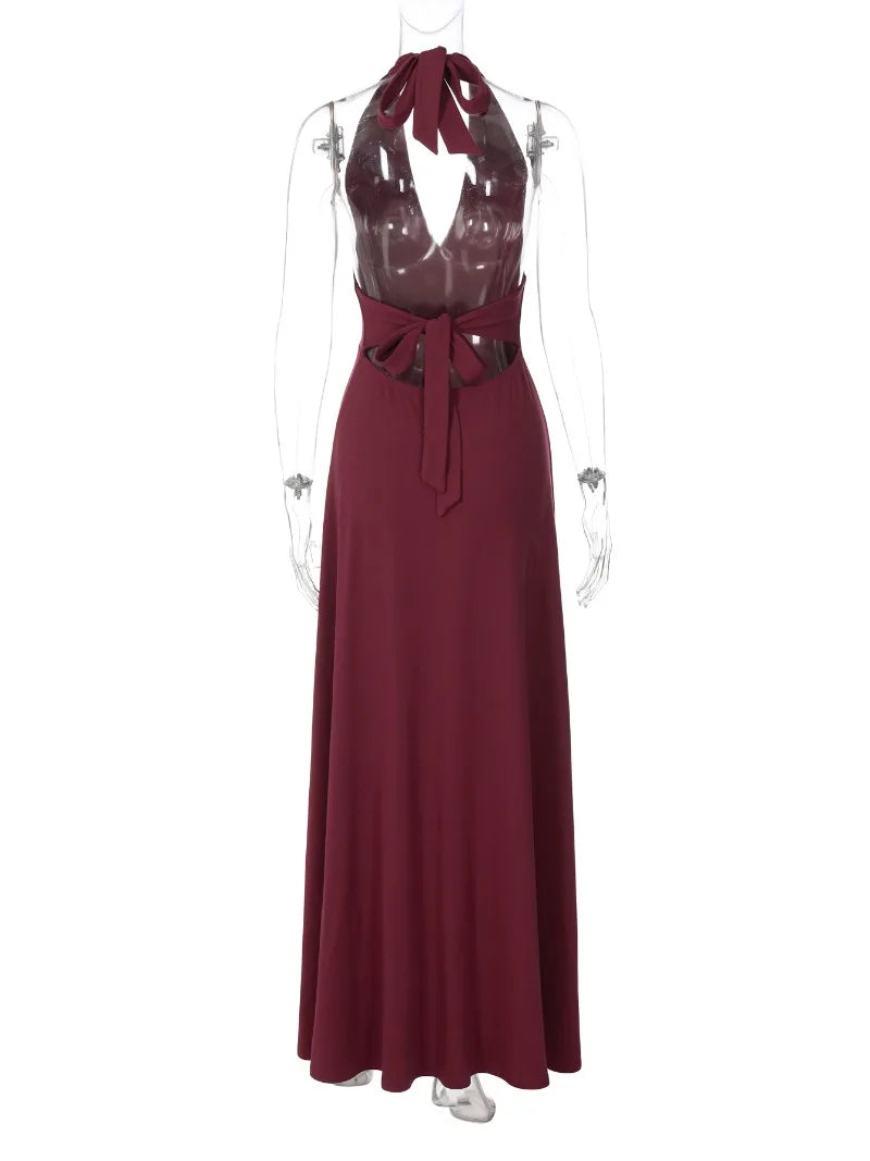 Maroon evening gown on a mannequin against a white background