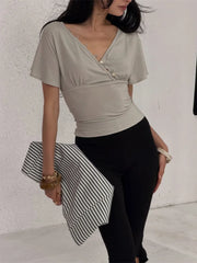 V-neck button-up cropped top with flutter sleeves