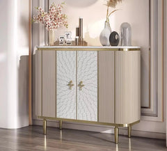 Sculpted wood cabinet with gold legs and luxury finish for entryways