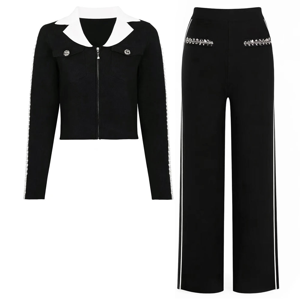 Black knit jacket with white collar and embellished sleeves, paired with wide-leg black trousers with white side stripes.