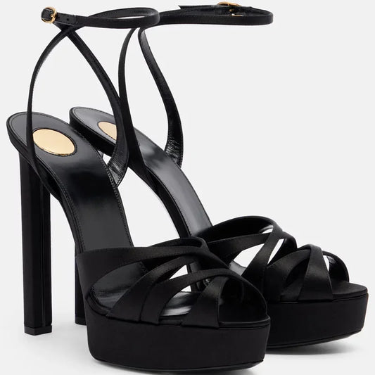 Black platform block heel sandals with crisscross straps and ankle buckle