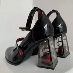 Patent Mary Jane heels with transparent block heel and rose detail